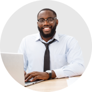 Headshot of a man smiling in his office