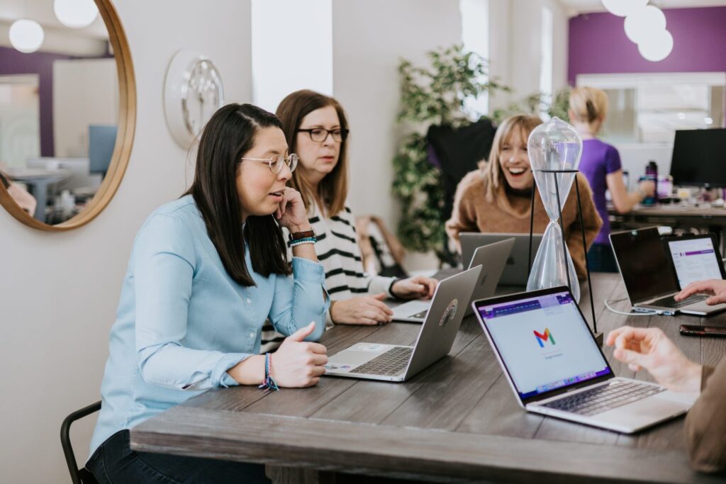 An image of women at a table talking while discussing ERG metrics. 